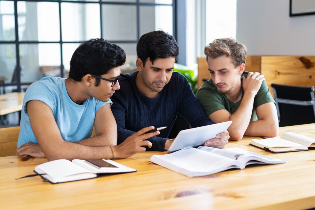 A diverse group of students collaborating on a project in a vibrant college campus.